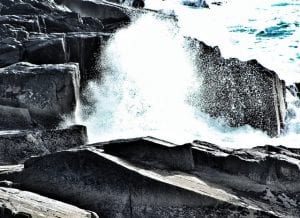 Climate Change Waves Crashing Onto Rocks