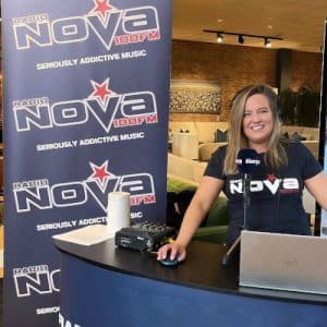 nova presenter standing b indoor broadcast desk