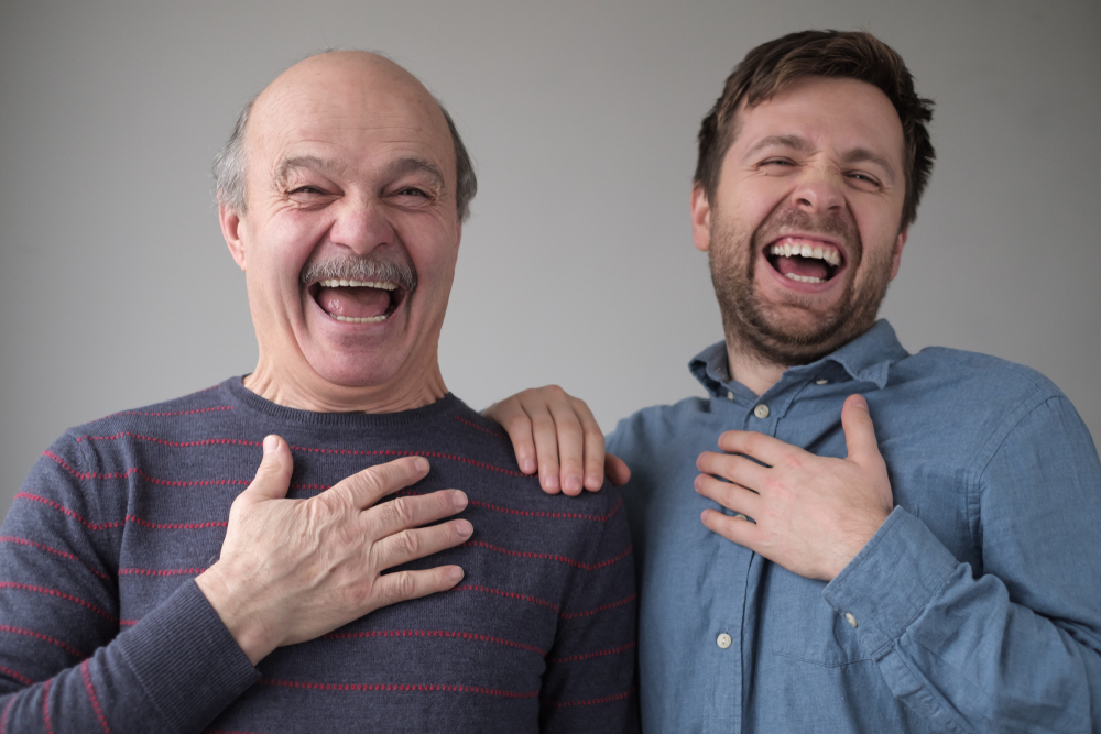 Father and son laughing together.