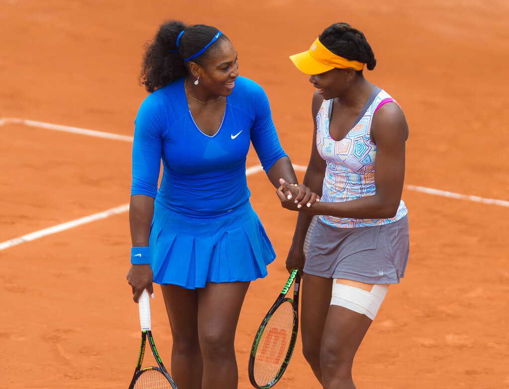 Serena Williams $50,000 Fine Near-Miss After Wimbledon Loss 7 Serena Williams and Venus Williams in doubles action at the 2016 French Open. Jimmie 48 Photography, Shutterstock
