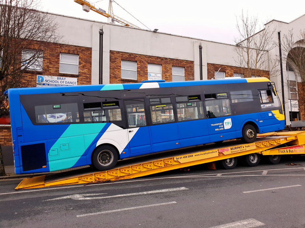 TFI bus being towed after breaking down. Bus Eireann. Public Transport. Traffic.