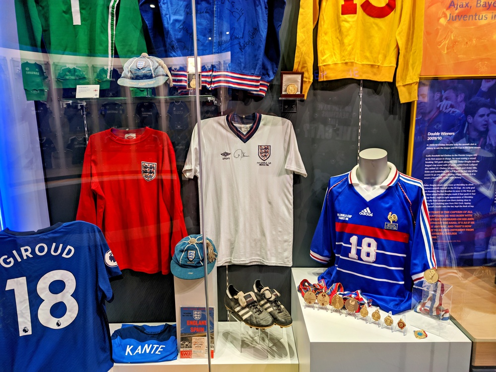 Historical football jerseys on display at the Stamford Bridge stadium museum, Chelsea Football Club. Shutterstock