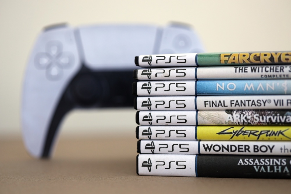 Stack of PS5 videogame disc boxes