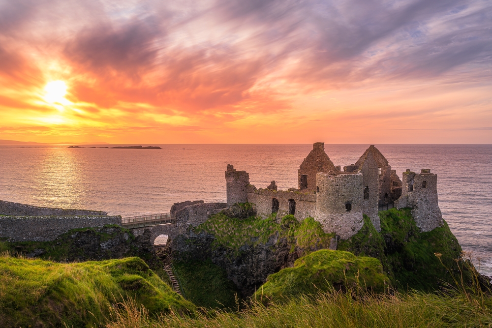 Sunset at ruins of Dunluce Castle, Northern Ireland. Shutterstock
