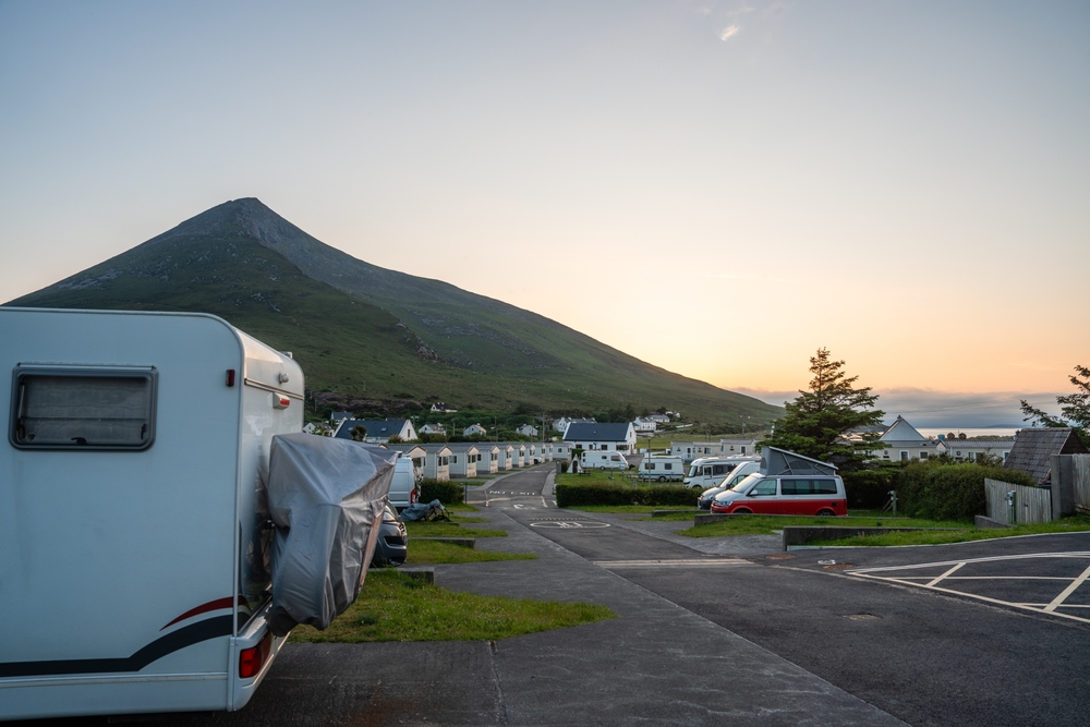 Are You A Happy Camper? Survey Finds Camping Boosts Mental Health 4 Motorhome parking in picturesque mountain landscape at dusk in Ireland. Image credit: Shutterstock