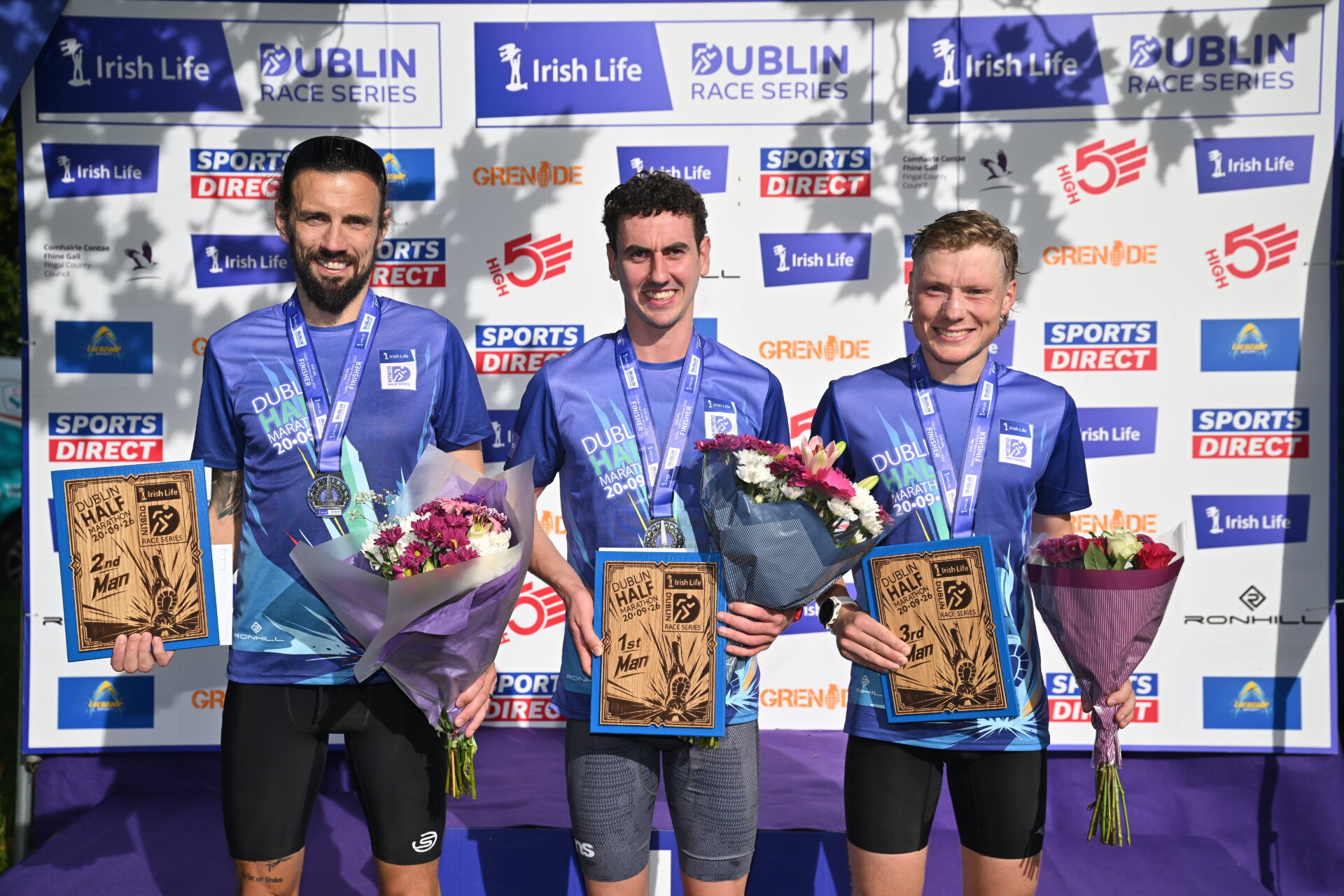 Hyland and Ryan Secure Wins at Sold-Out Irish Life Dublin Half Marathon 3 Men's top 3 finishers, from left, second place Eddie O'Connor of brothers Pearse AC, winner James Hyland, Raheny Shamrocks, and third place Matthew Mc Connell from Wicklow pictured after the 2026 Irish Life Dublin Half Marathon, which took place on Sunday 20th September in Phoenix Park, marking the final event of the 2026 Irish Life Dublin Race Series. Photograph: Sam Barnes/Sportsfile