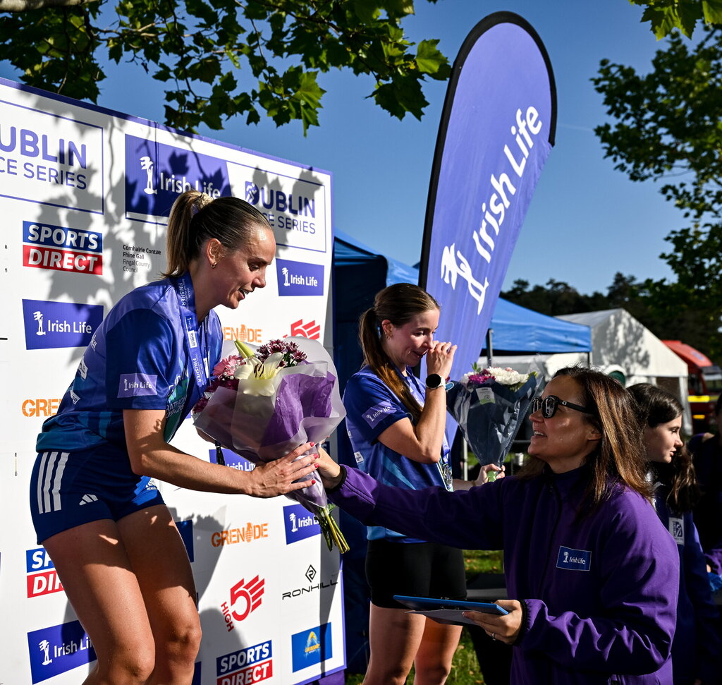 Hyland and Ryan Secure Wins at Sold-Out Irish Life Dublin Half Marathon 4 Barbara O'Malley, Chief People Officer, Irish Life, presents to Women's winner Meghan Ryan from Dublin after the 2026 Irish Life Dublin Half Marathon, which took place on Sunday 20th September in Phoenix Park, marking the final event of the 2026 Irish Life Dublin Race Series. Photograph: Sam Barnes/Sportsfile