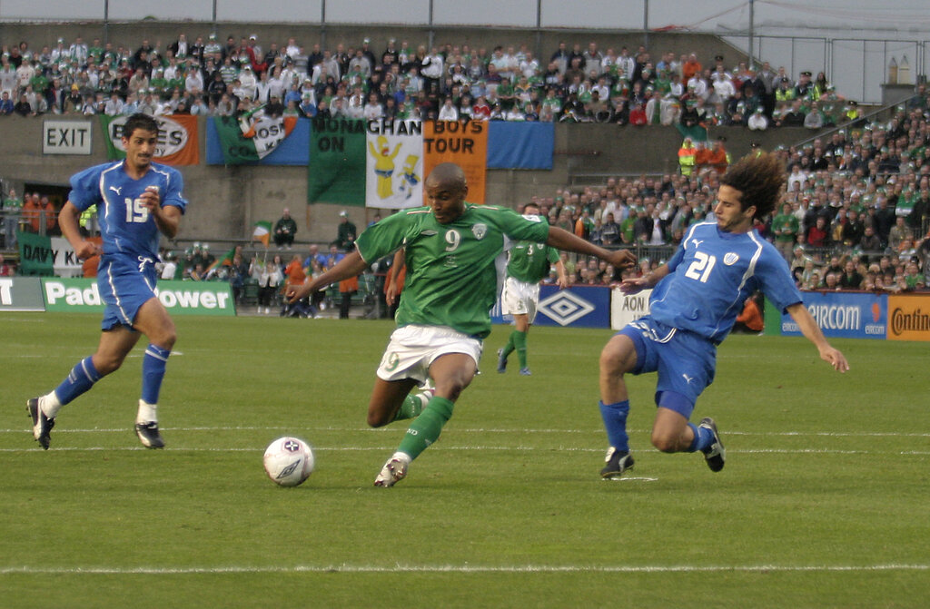 Israel Players Refuse To Swap Jerseys With Ireland, Report Shows 3 Clinton Morrison shoots past Saban Klemi.Ireland V Israel,World Cup Qualifier, 04 June 2005,Lansdowne Road,Dublin. Photo credit: Eoghan McNally, Shutterstock