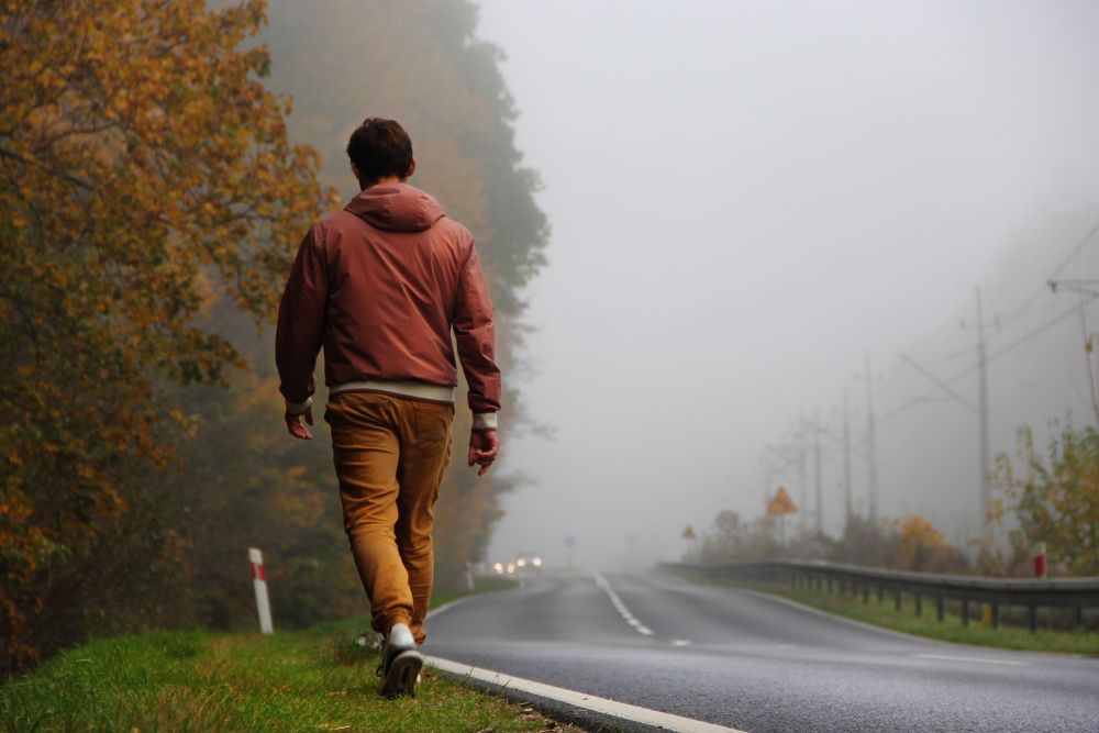Man walking on motorway