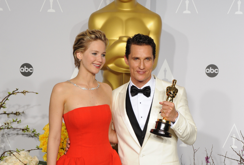 Matthew McConaughey & Jennifer Lawrence at the 86th Annual Academy Awards, 2014. Photo credit: Featureflash Photo Agency, Shutterstock