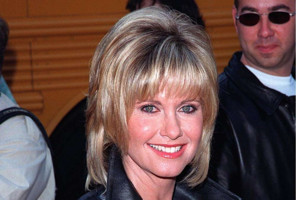 OLIVIA NEWTON JOHN at 20th anniversary re-premiere of 'Grease' in Hollywood, in 1998. Photo credit Featureflash Photo Agency, Shutterstock